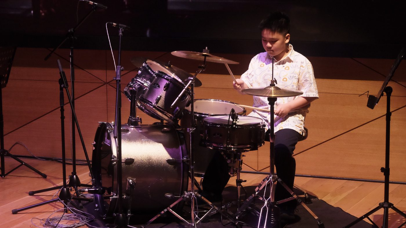 Young drummer performing in the finals